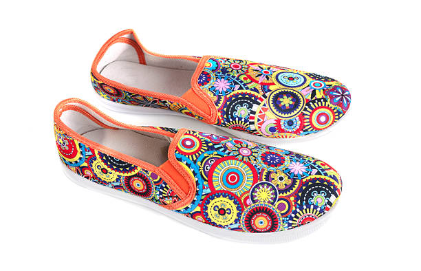 colorful shoes in front of white background