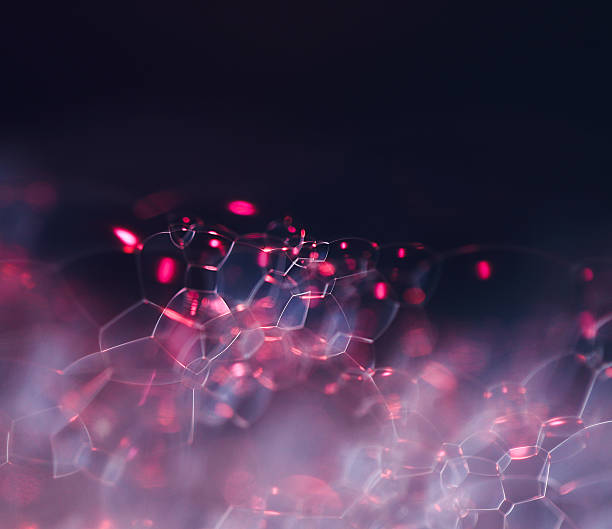 istock beautiful white soap foam with pink backlight on a dark background 2215363001