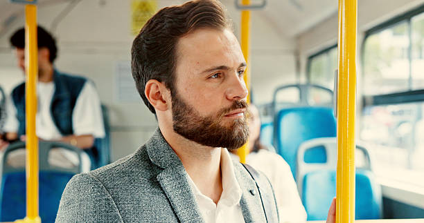 istock Business, thinking and passenger with man on bus for reflection, journey and sightseeing. Public transportation, vision and idea with person in tram vehicle for travel, commuter and destination 2215364003