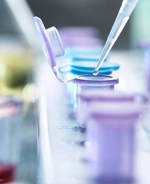 istock A close-up shot shows a pipette dripping liquid into a test tube for a lab experiment. 2215364638