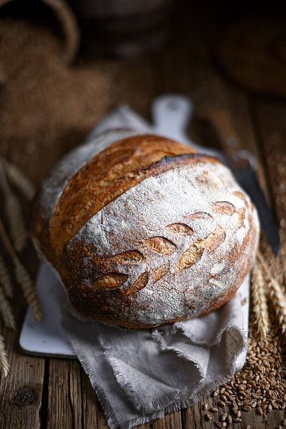 Browned crusty sourdough bread with cracked top