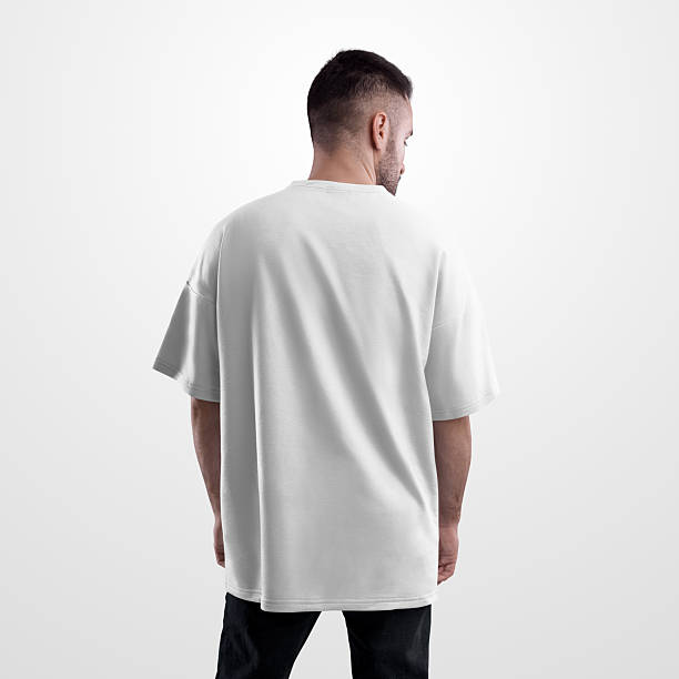 istock Oversized white t-shirt mockup on bearded man in black jeans, back view, isolated on background. 2215366412