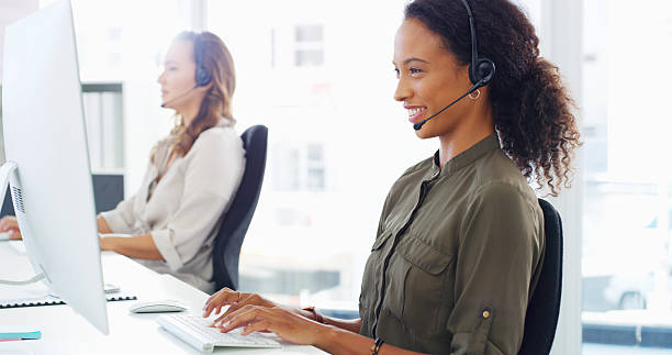istock Computer, woman and happy with headset in call center for technical support, online advice and troubleshooting help. Contact us, consultant and friendly with inbound query or network issue resolution 2215366518