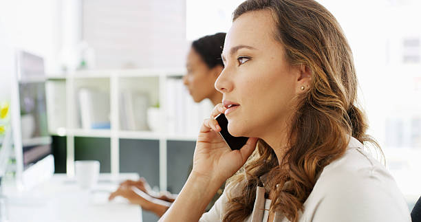istock Phone call, corporate communication and woman in workplace, negotiation or networking with mobile discussion. Contact, conversation and business deal with feedback, consulting and coworking office 2215366624