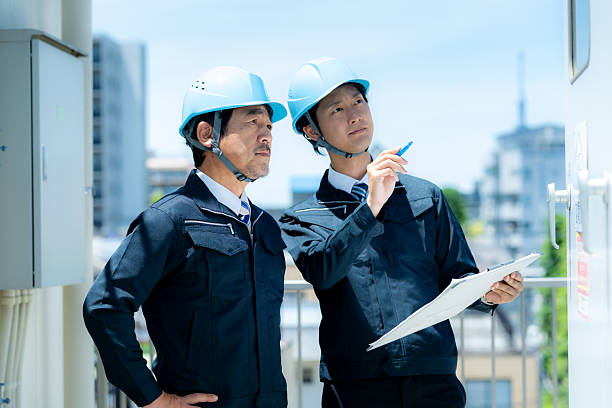 istock Businessmen in work clothes having a meeting 2215367881