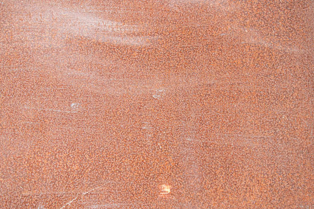Rusty old metal wall in the sun, background texture