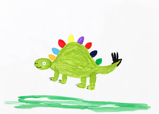 Smiling latin preschool kid boy having fun with dough, colorful modeling compound clay animals as a turtle, tiger and more in his bedroom studio.