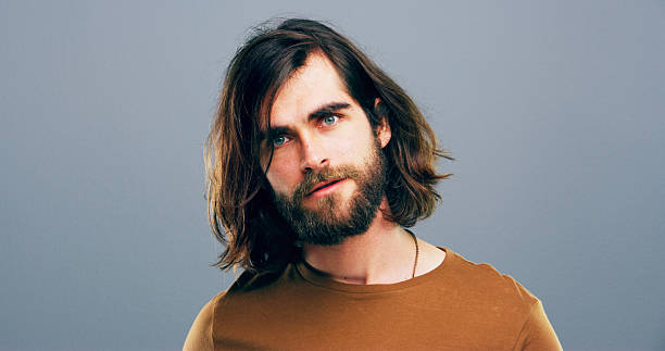 istock Face, portrait and man with space, studio and positive mindset for career growth, creative or business. Gray background, mockup and writer person with freelancer, professional headshot and confidence 2215370211