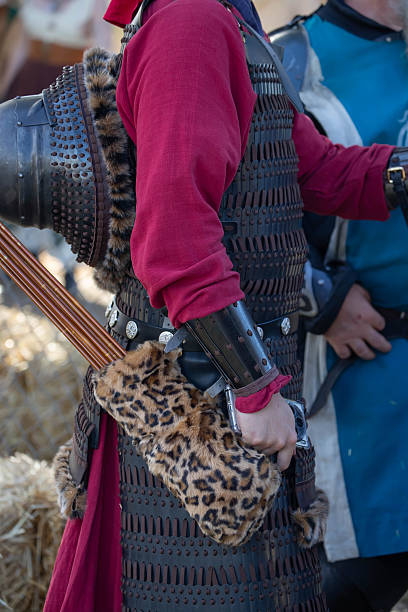 istock Archer in historical costume aims longbow at a target during a Medieval Fair during a local community event 2215370705