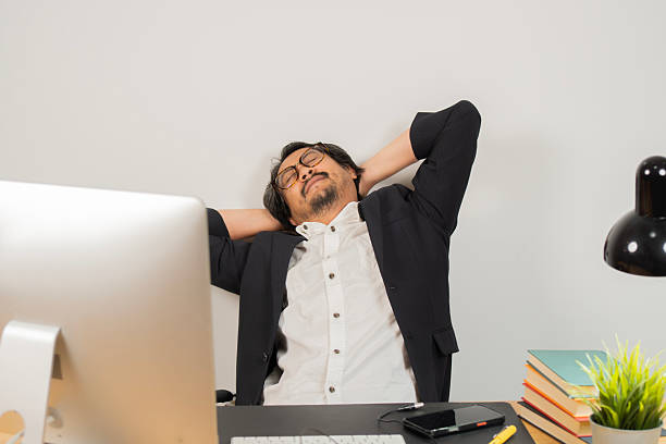 istock Relaxed man take break from work put hands behind head lean on comfy chair closing eyes feels serenity 2215370832