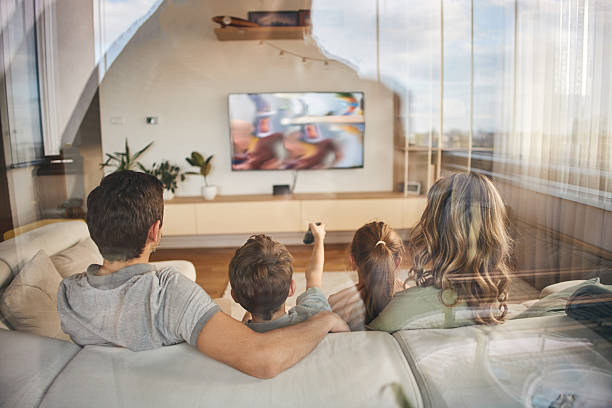 istock Family watching TV 2215371269