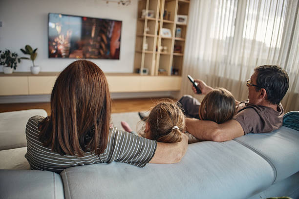 istock Multi-generation family watching TV 2215371965