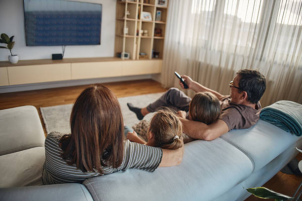 istock Multi-generation family watching TV 2215372030