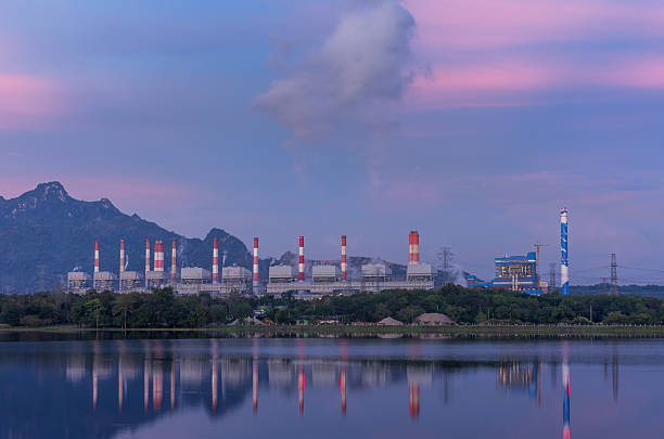 istock Power plant with reflection at dusk, with mountain background 2215374156