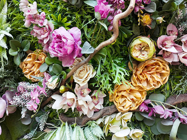 istock Floral background: ranunculus, orchids, roses and green grass, branches and moss. 2215375353