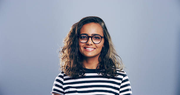 istock Portrait, space and student with woman in studio for writer, education or learning. College, scholarship and university with creative person on gray background mockup for journalism or study 2215377961