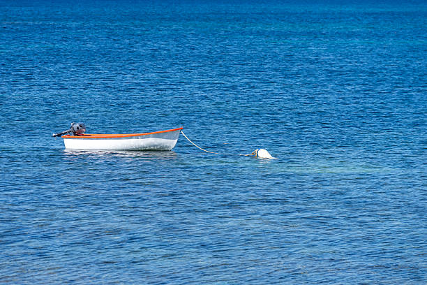 Spain, Mallorca, Palma, April 30, 2025 - A small motorboat attached to a buoy