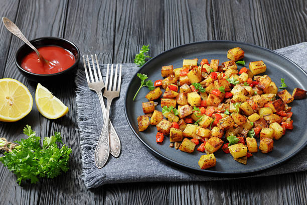 istock golden fried potatoes cubes with red bell pepper 2215383330