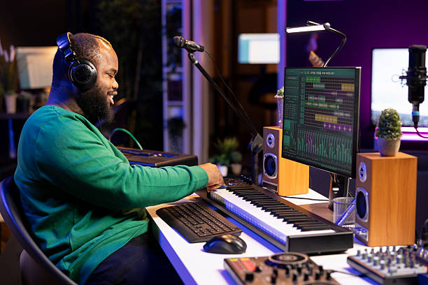 istock Music producer adding piano key notes over his audio recordings 2215385093