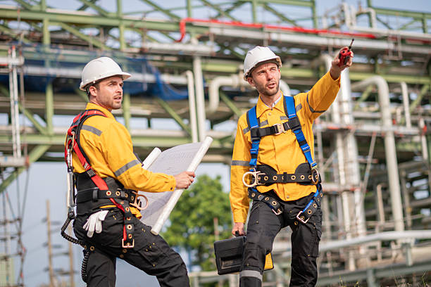istock Surveyor engineers team wearing safety uniform checking inspection by  inspection and checking construction process railway switch and checking work on railroad site is industry transportation concept. 2215387511