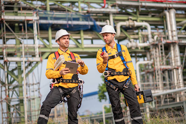 istock Surveyor engineers team wearing safety uniform checking inspection by  inspection and checking construction process railway switch and checking work on railroad site is industry transportation concept. 2215387524