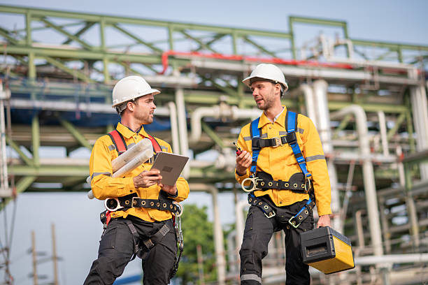 Surveyor engineers team wearing safety uniform checking inspection by  inspection and checking construction process railway switch and checking work on railroad site is industry transportation concept.