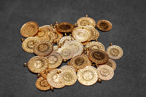 Turkish Jewelry Gold Coin with Front and Back Views in the middle of Turkish Jewelry Gold Coin Stack on Infinite Background.