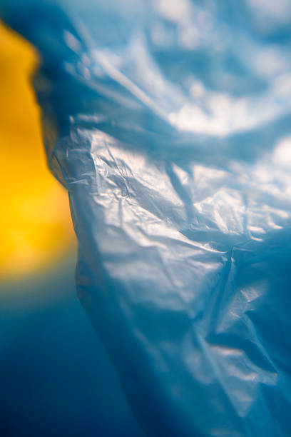 Blue and yellow plastic bag wrinkled surface detail