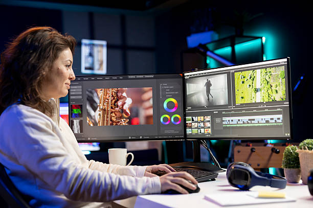 istock Smiling video editor using editing software to upgrade footage shot 2215394617