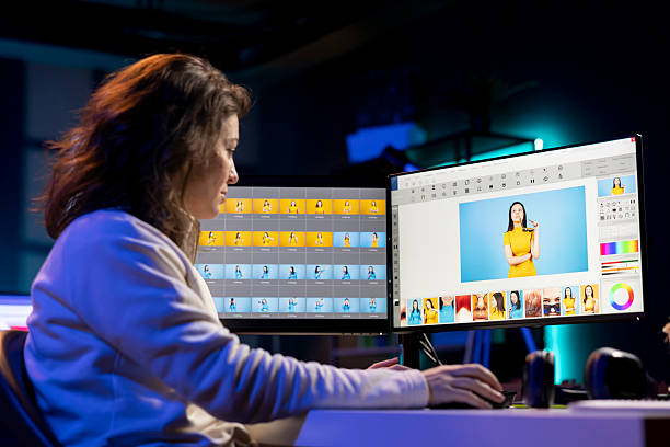 istock Freelancer browsing images taken on DSLR in creative multimedia agency 2215395539