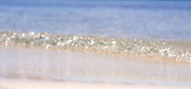 istock Perfect  beach. Abstract background., sea ​​surf on sandy shore 2215397253