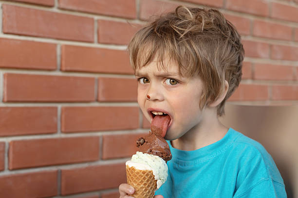 istock The boy is eating ice cream. He is excited 2215403489