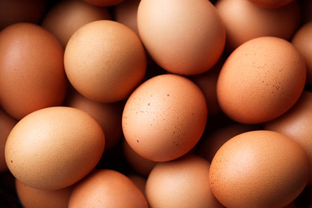 Close-up of many chicken red eggs background.