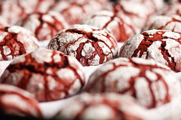 istock Red velvet crinkle cookies on a white baking paper. 2215406285