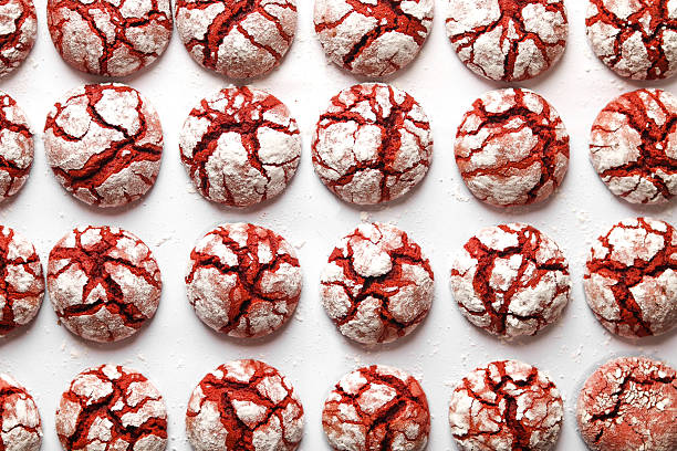 istock Red velvet crinkle cookies on a white baking paper. 2215406286