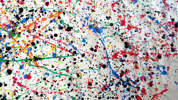 istock Large abstract splatter painting with multicolored paint drips and black ink spots on crumpled white canvas 2215406734