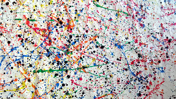 istock Large abstract splatter painting with multicolored paint drips and black ink spots on crumpled white canvas 2215406735