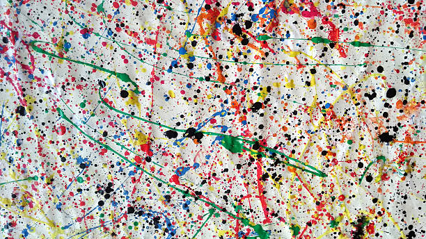 istock Large abstract splatter painting with multicolored paint drips and black ink spots on crumpled white canvas 2215406755