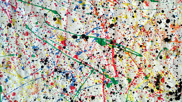 istock Large abstract splatter painting with multicolored paint drips and black ink spots on crumpled white canvas 2215406756