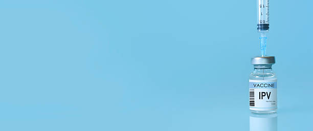 istock IPV polio vaccine bottle placed on a clean blue background, symbolizing global immunization, disease prevention, modern healthcare innovation, scientific medical research with copy space for design. 2215406781