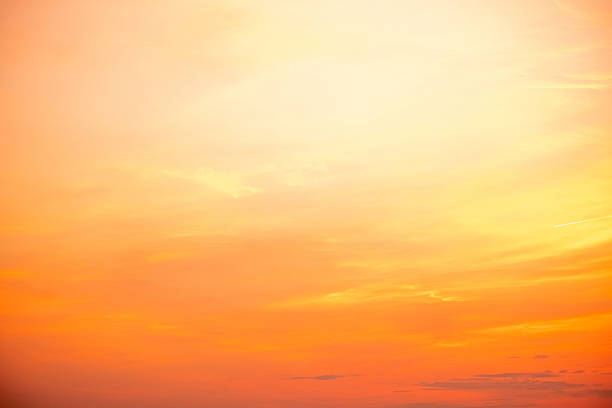 istock Sky,sunset, beautiful , luxury soft gradient orange gold clouds and sunlight on the blue sky perfect for the background, Sunrise on morning or everning in winter warm time ,Twilight summer,silhouette 2215408217