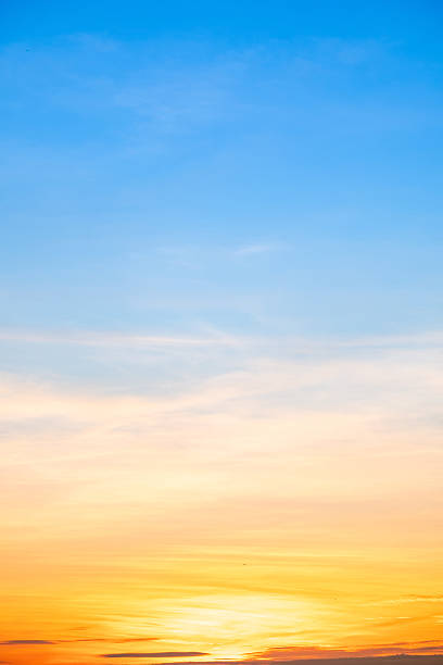 istock Sky,sunset, beautiful , luxury soft gradient orange gold clouds and sunlight on the blue sky perfect for the background, Sunrise on morning or everning in winter warm time ,Twilight summer,silhouette 2215408291