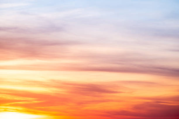 istock Sky,sunset, beautiful , luxury soft gradient orange gold clouds and sunlight on the blue sky perfect for the background, Sunrise on morning or everning in winter warm time ,Twilight summer,silhouette 2215408381