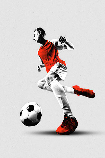 istock Poster. Contemporary artwork. Soccer player in red moves with precision and control, eyes fixed on ball mid-play against grey background. Textured. 2215408412