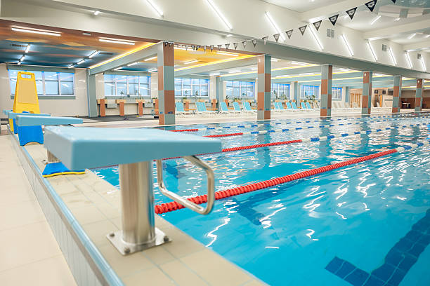 istock Picture of a modern empty swimming pool with blue water 2215412314