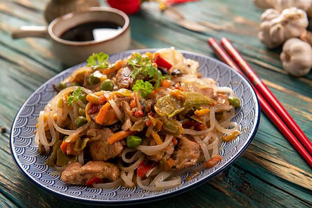 istock Chinese noodles with vegetables and chicken 2215413471