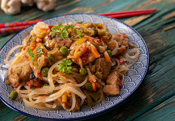 istock Chinese noodles with vegetables and chicken 2215413495