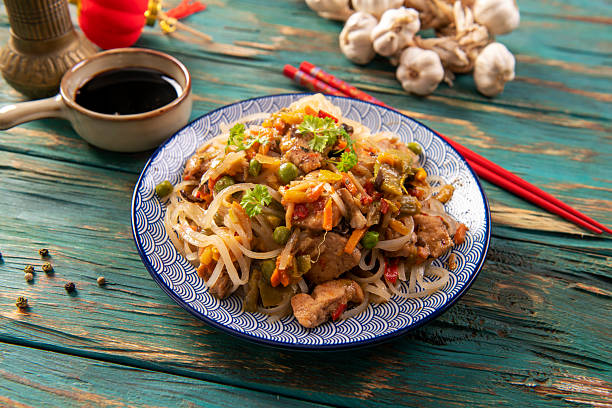 istock Chinese noodles with vegetables and chicken 2215413552