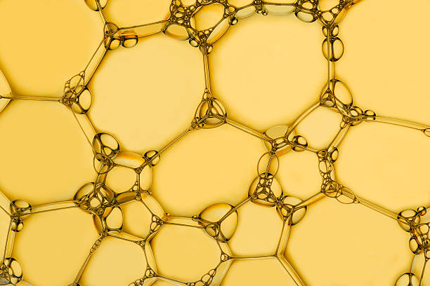 istock Macro photo of soap bubbles on a yellow background 2215413673