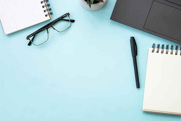 istock Office table desk with laptop, notepad and pen. 2215414786